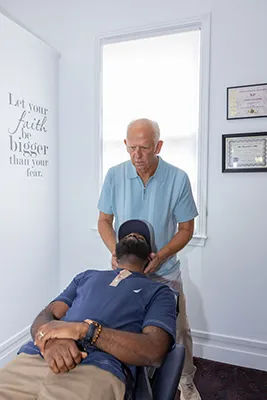Chiropractor Mobile AL Donald Ellis Adjusting A Patient Chiropractor Mobile AL Donald Ellis Adjusting A Patient