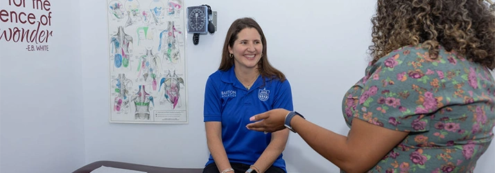Patient With Questions AT Discover Chiropractic Center Meeting With Staff