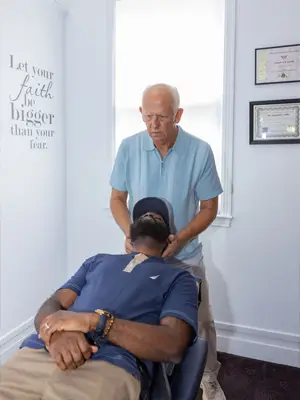 Chiropractor Mobile AL Donald Ellis Adjusting Male Patients Neck Chiropractor Mobile AL Donald Ellis Adjusting Male Patients Neck