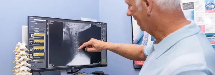 Chiropractor Mobile AL Donald Ellis Examining X-Ray Chiropractor Mobile AL Donald Ellis Examining X-Ray