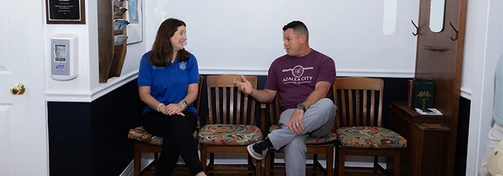 Patient Speaking with Practitioner About Scoliosis
